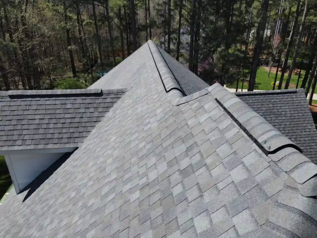 The Importance of Having Filtered Ridge Vent Instead of Unfiltered Ridge Vent 5 Completed filtered ridge vent installation on asphalt shingle roof for attic ventilation